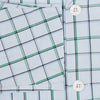 View 4 of product The Turnbull & Asser Green and Blue Check Pyjama Shirt features long sleeves and a button-up design on a white base, offering elegant loungewear style. Shown laid flat against a white background.