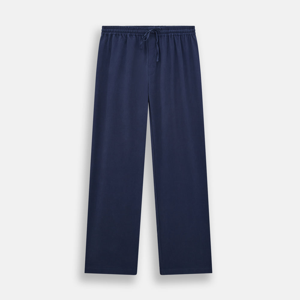 Turnbull & Asser Navy Silk Pyjama Set, laid flat on a white background, includes a long-sleeve button-up shirt with chest pocket and drawstring pants.