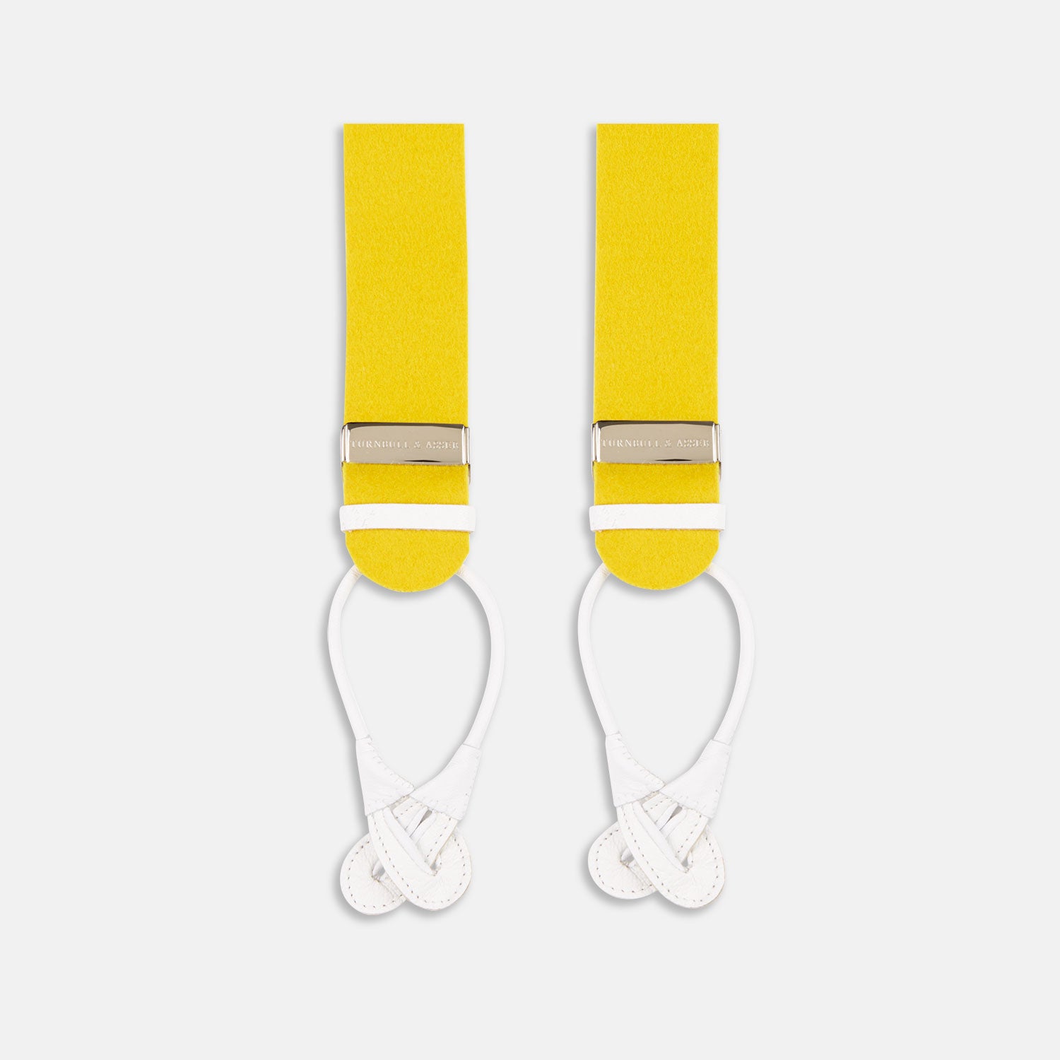 View 1 of product The Turnbull & Asser Golden Adjustable Felt Braces feature yellow elastic, silver metal clips, and white leather loops, evoking classic English style. Shown against a white backdrop.