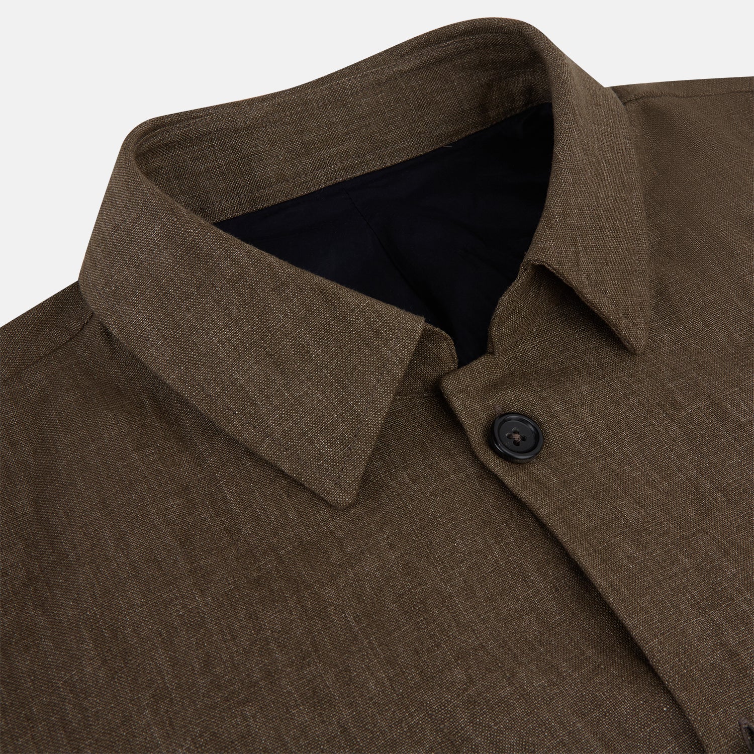 View 2 of product The Pine Cone Linen Holland Shacket by Turnbull & Asser is a brown men's lightweight outerwear piece with a collar, long sleeves, three front zip pockets, and black buttons, shown on a white background.