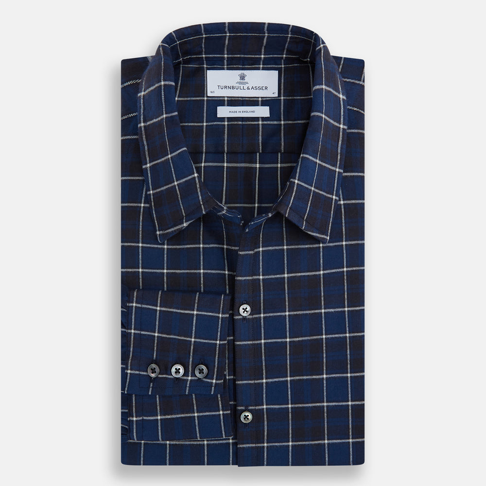 The Turnbull & Asser Navy and White Check Windsor Shirt features a long-sleeve design with a navy base and white check pattern, showcasing British craftsmanship and displayed on a white background.