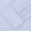 View 2 of product Displayed on a plain white background, the Turnbull & Asser Tailored Fit Two-Fold 120 Light Blue Cotton Shirt features a kent collar, double cuffs, and white buttons. The label inside highlights its Jermyn Street, London origin.