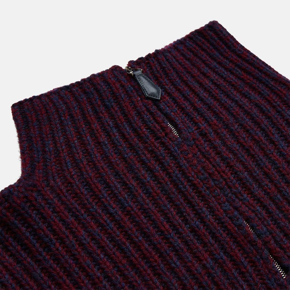 The Turnbull & Asser Burgundy Mullion Half Zip Rib Cashmere Jumper features a high collar and half-zip front in dark red and navy cashmere, shown laid flat on a white background—ideal for an elevated casual look.