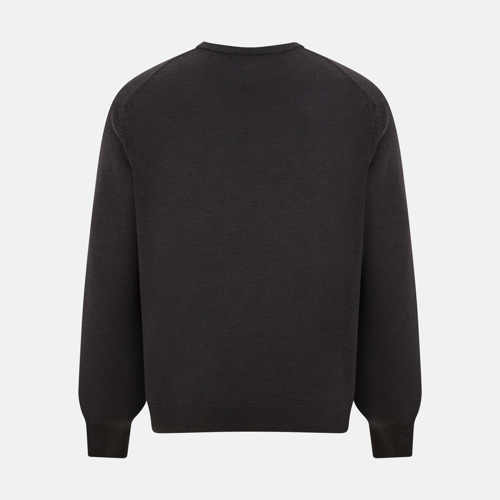 The Turnbull & Asser Charcoal Grey Merino V Neck Jumper is a classic long-sleeve knit with ribbed cuffs and hem, featured in our knitwear collection and shown against a white background.