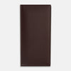 View 1 of product The Turnbull & Asser Burgundy B Cut Continental Wallet, with smooth, unadorned surfaces and visible edge stitching, is pictured closed in rich burgundy Italian leather against a white background.
