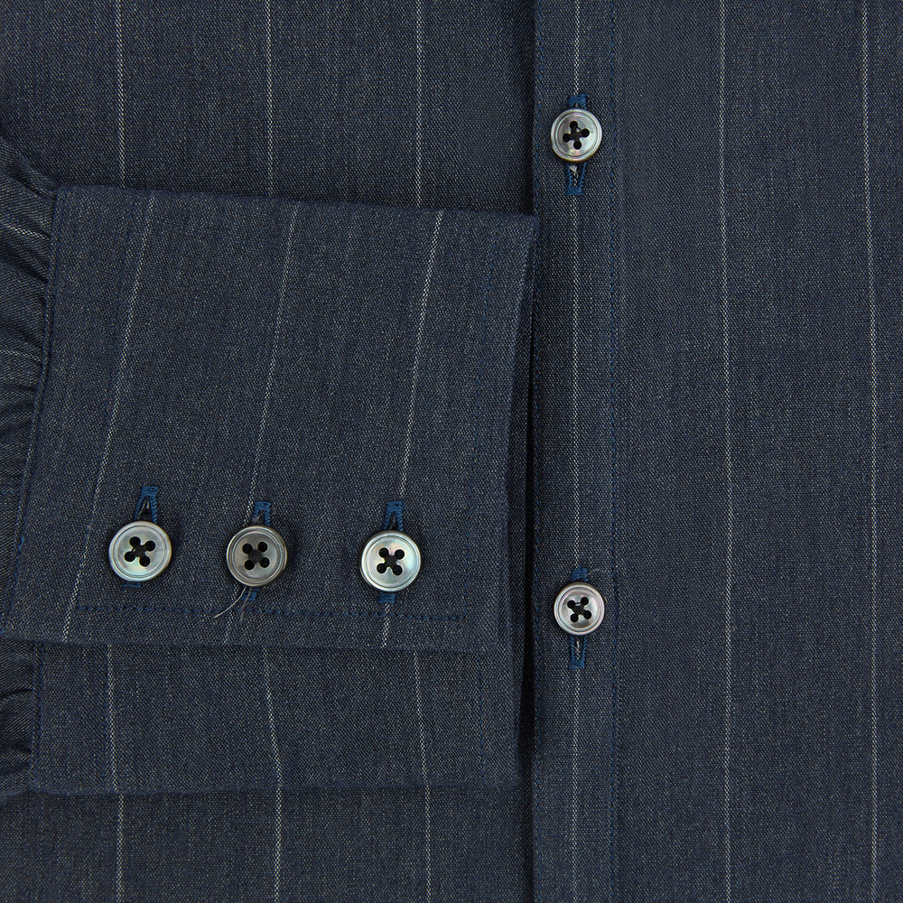 The Turnbull & Asser Navy Melange Wide Stripe Westminster Shirt features a classic collar, buttoned cuffs, and a tailored fit, showcasing British craftsmanship. Laid flat on a white background.