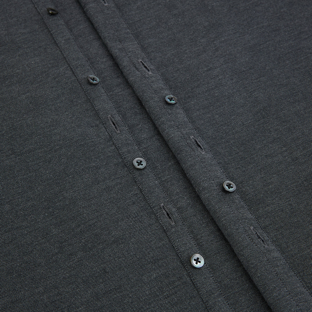 The Charcoal Melange Westminster Shirt by Turnbull & Asser features a long-sleeve, button-up design with a Turnbull collar and buttoned cuffs, offering classic British craftsmanship in a timeless style.