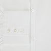 View 4 of product The PLAIN WHITE WESTMINSTER SHIRT WITH TURNBULL COLLAR AND 3-BUTTON CUFFS by Turnbull & Asser features refined British craftsmanship, long sleeves, a straight hem, and a crisp white design displayed on a plain background.