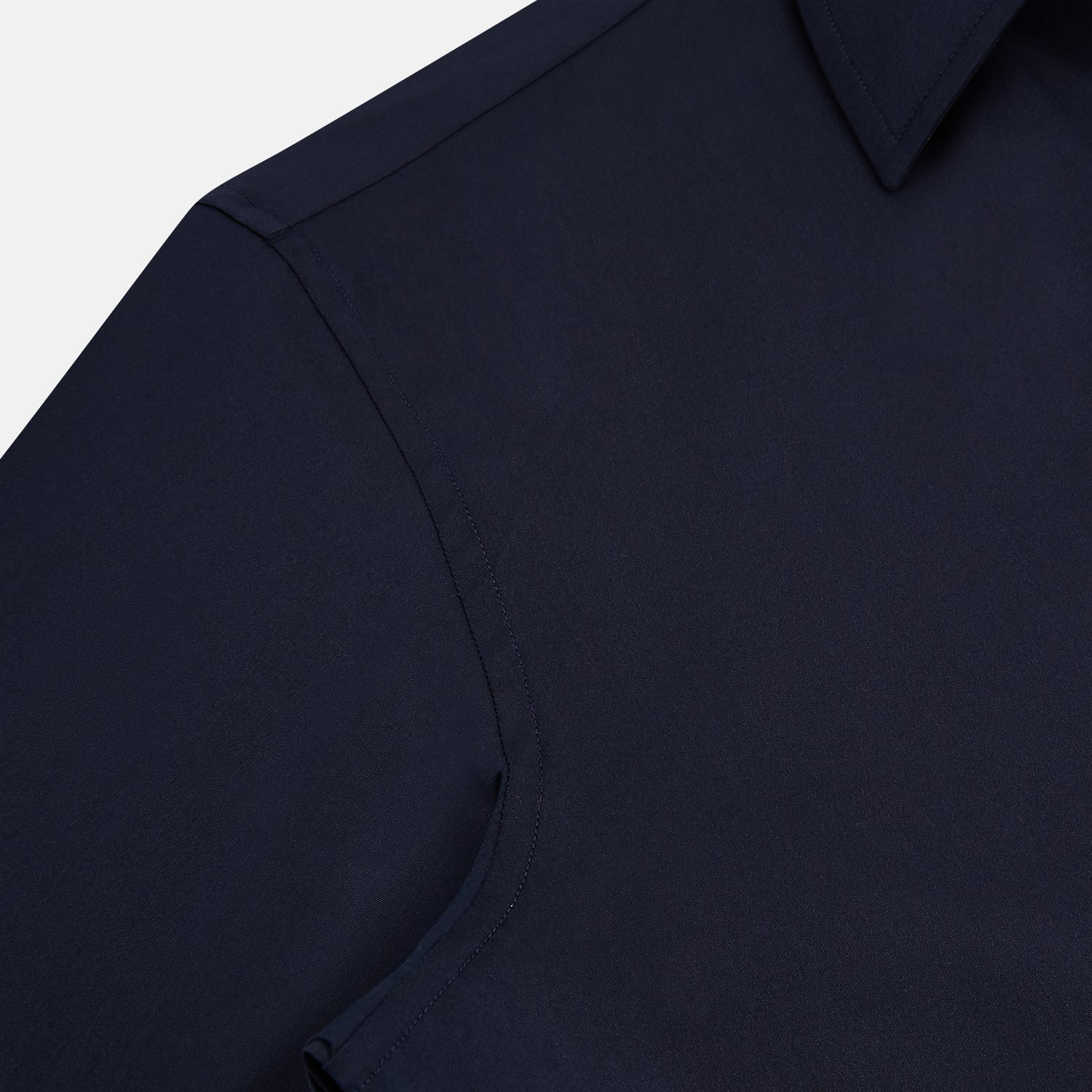 View 6 of product The Navy Westminster Shirt by Turnbull & Asser is a classic long-sleeve, button-up shirt with a pointed collar and buttoned cuffs, exemplifying British craftsmanship, shown against a plain white background.