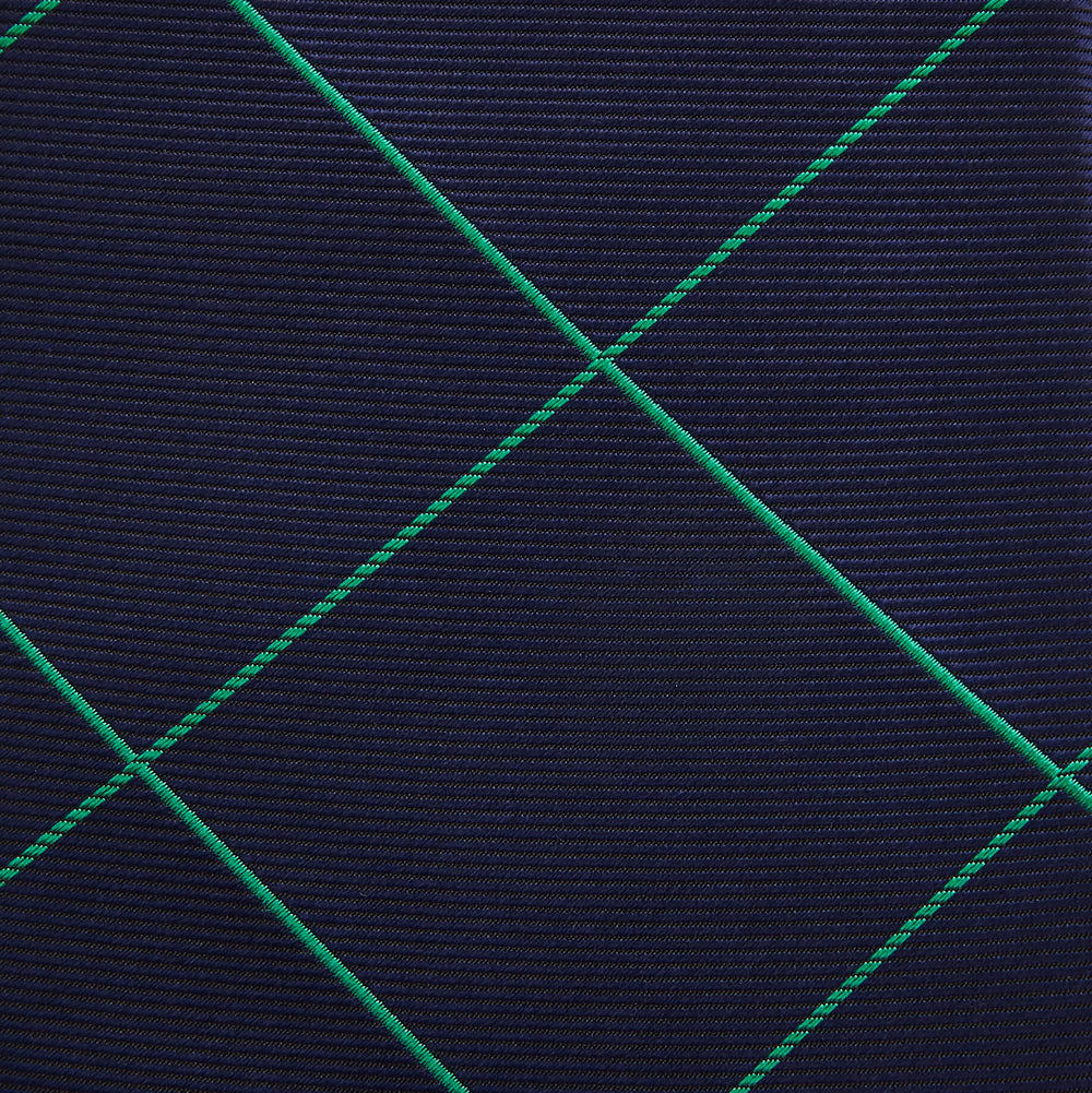 The Turnbull & Asser Green and Navy Window Pane Silk Tie features a subtle ribbed texture with a diagonal green grid pattern, inspired by archival designs—a stylish choice for modern office attire.