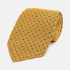 View 1 of product The Turnbull & Asser Navy and Yellow Micro Dot Silk Tie features evenly spaced dark blue micro dots on yellow silk, rolled and displayed on a white background—an elegant accessory for any occasion.