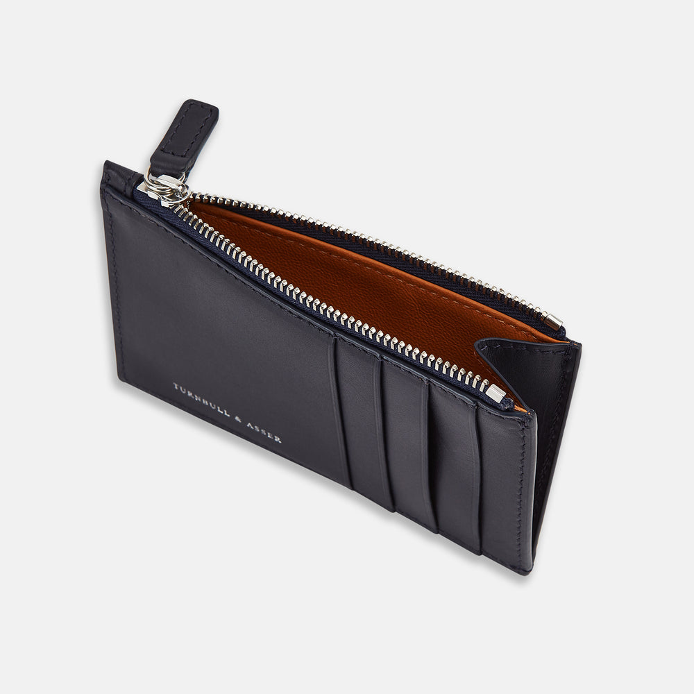 A navy Italian leather zip coin and card holder with a slim design, featuring multiple card slots and a zipper pouch. The Turnbull & Asser name is embossed on the front, with a brown-lined interior.