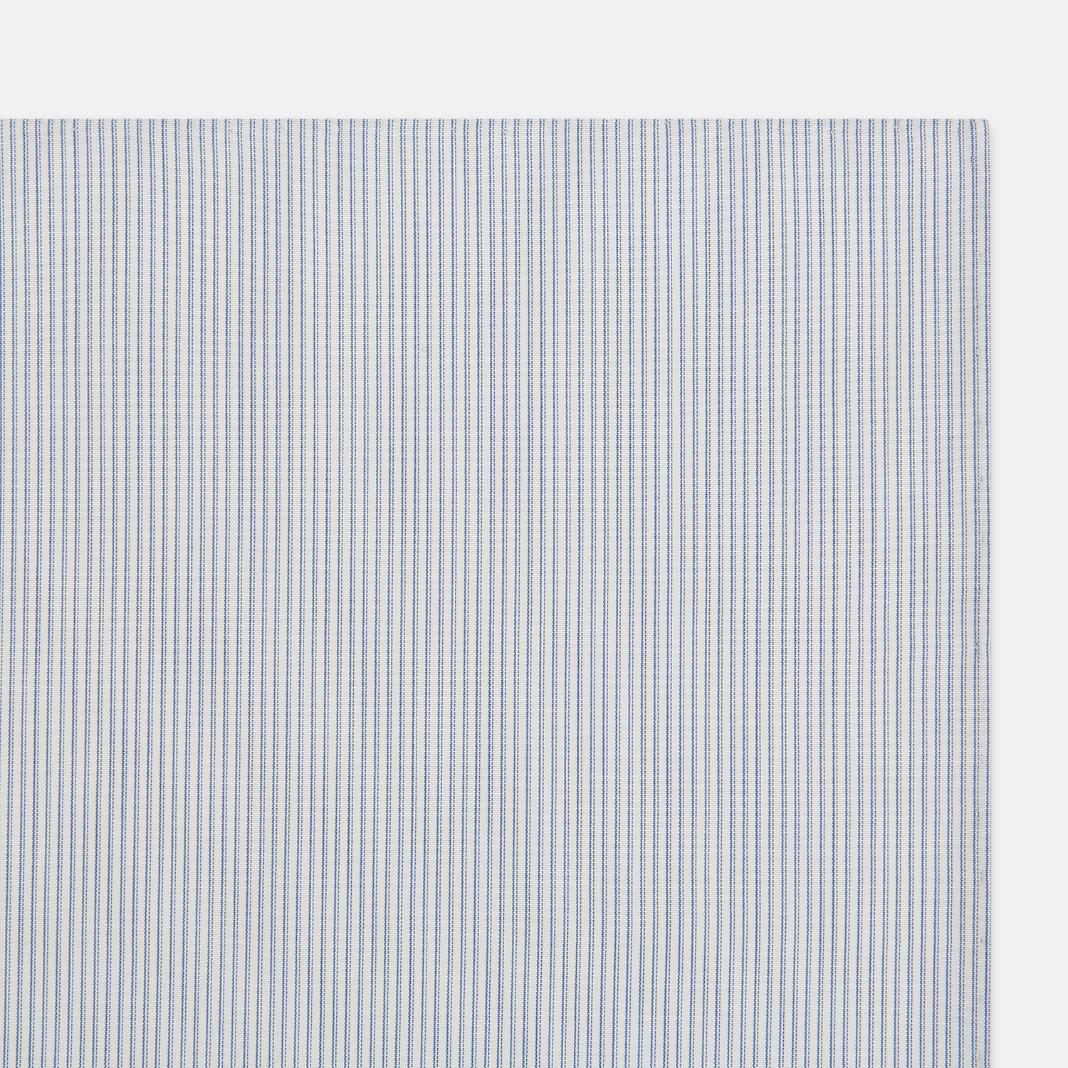 View 2 of product The Turnbull & Asser Sky Blue Hairline Stripe Hand-Rolled Handkerchief, featuring thin blue and white stripes and hand-rolled edges, is displayed flat on a white background.