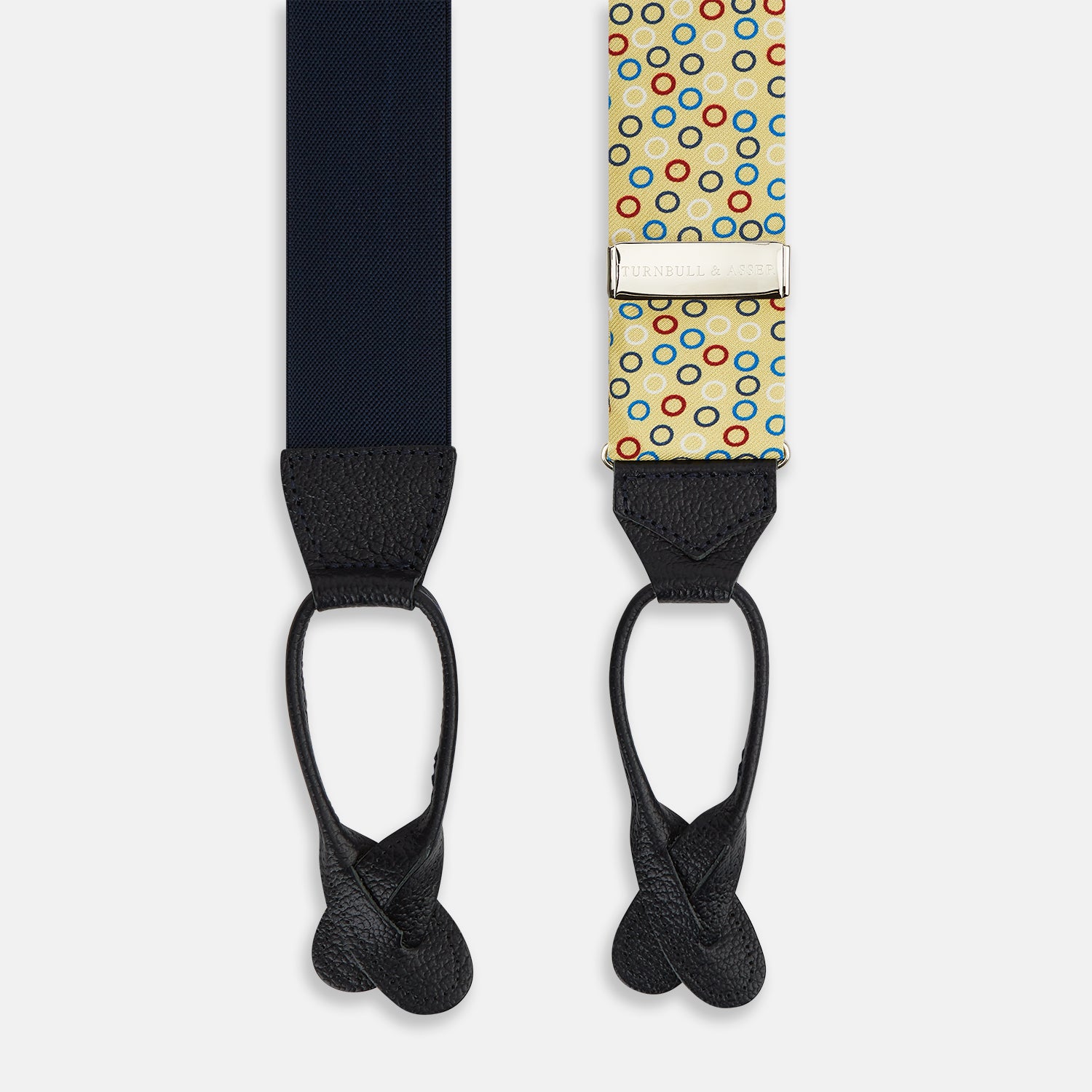 Image 2 of product Turnbull & Asser Multi-coloured Circle Yellow Adjustable Silk and Navy Leather Braces, featuring gold-toned metal clips, bring refined style to any outfit. Shown laid flat on a white background.