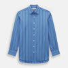 View 1 of product The Turnbull & Asser Colony Blue Track Stripe Mayfair Shirt is crafted from Italian cotton with long sleeves, dark blue track stripes, a classic collar, and buttoned cuffs, shown against a white background.