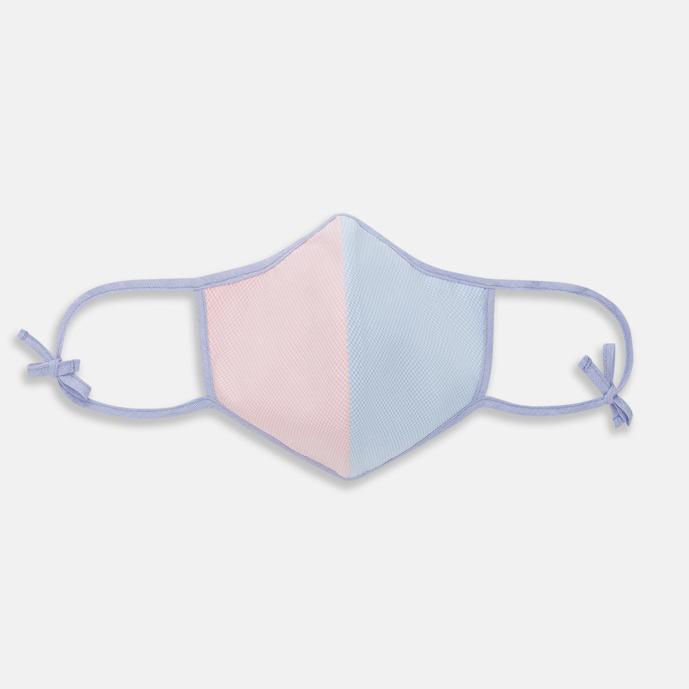 The Turnbull & Asser Pink & Blue Check Commuter Mask features lavender adjustable ear loops tied in bows and comes with 3 Viroformula™ filters. Shown on a plain white background.