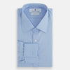 View 5 of product The Turnbull & Asser Blue Cotton Shirt features a T&A collar, double cuffs, and white buttons. This classic formal shirt is perfect for any gentleman and pairs effortlessly with a navy suit. Displayed on a plain white background.