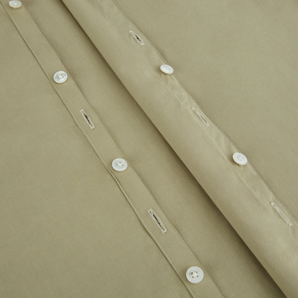 The TAUPE WINDSOR SHIRT by Turnbull & Asser features a Windsor collar and buttoned cuffs. This long-sleeve shirt showcases refined British design and is displayed flat on a white background.