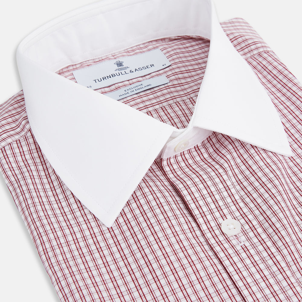 The Turnbull & Asser Red Micro Check Shirt features a crisp white contrast T&A collar and cuffs, crafted in Italian cotton. Timeless style is showcased against a plain white background, inspired by classic Turnbull & Asser designs.