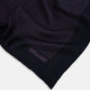 View 2 of product A navy silk pocket square with thin, even purple stripes and hand-rolled edges from Turnbull & Asser, featuring "Turnbull & Asser Hand Printed in England" printed in the corner.