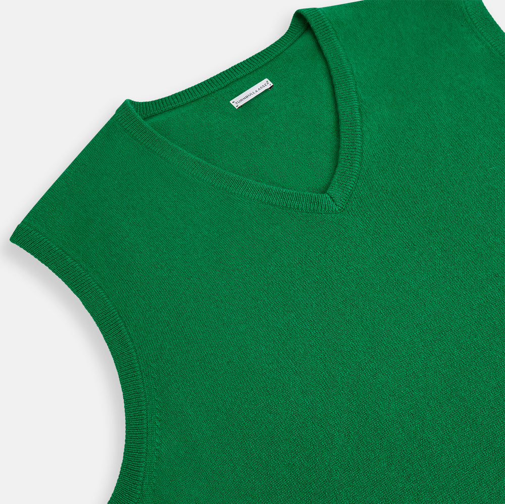 The Turnbull & Asser Grass Green Cashmere V-Neck Vest is shown against a plain white background, offering a refined choice for a distinguished ensemble.