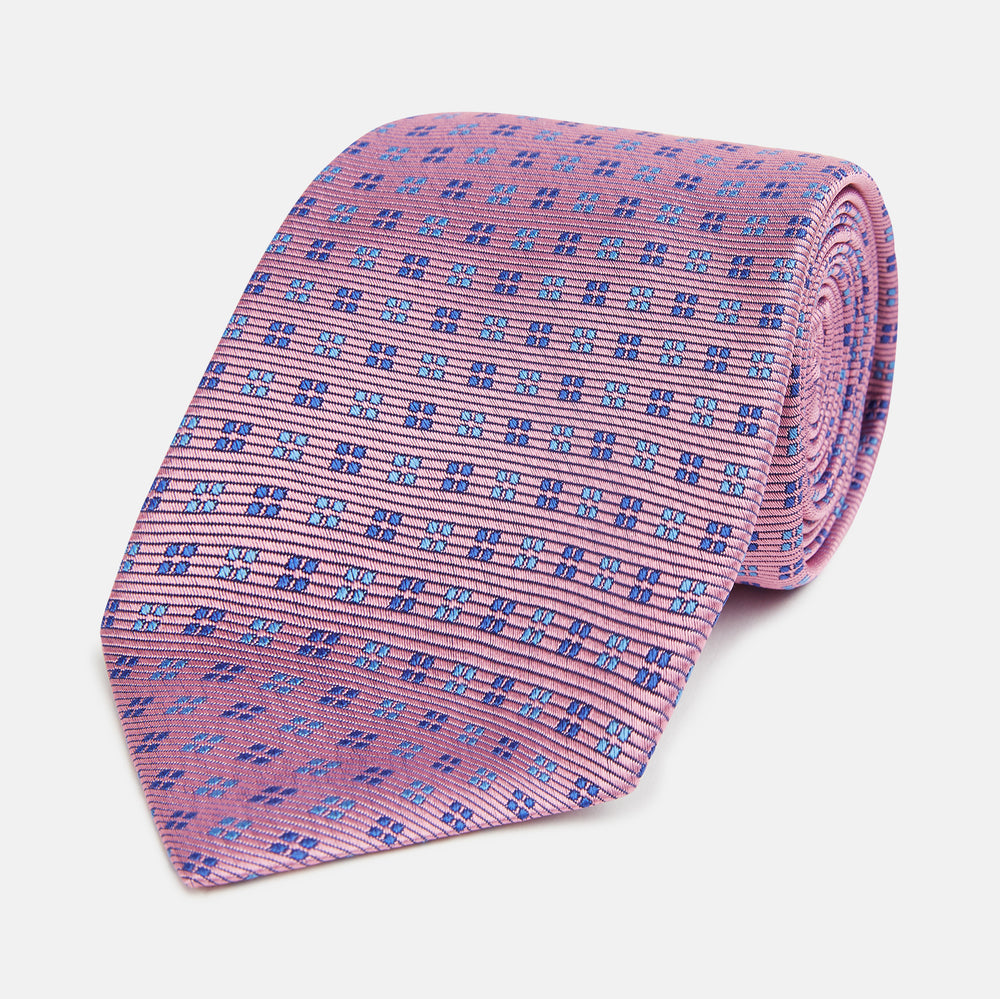 The Turnbull & Asser Blue and Pink Multi Dot Silk Tie adds a stylish, modern touch to office attire.
