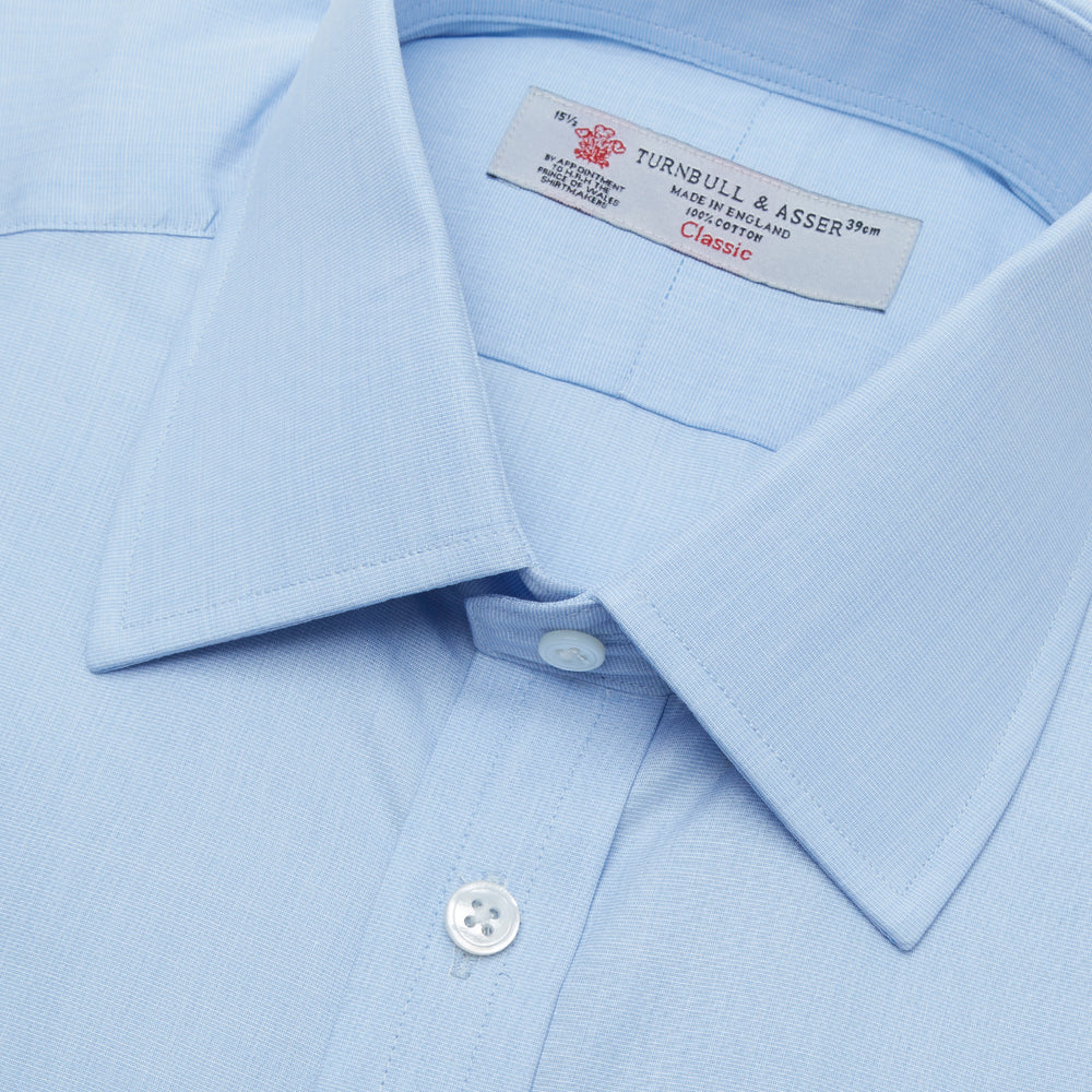 A Grey Cashmere Blend Shirt by Turnbull & Asser with a T&A collar and 3-button cuffs is neatly folded, showing its label, on a plain white background.