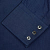 View 5 of product The Turnbull & Asser Dark Blue Denim-Cashmere Shirt features a Regent collar, long sleeves, and 3-button cuffs, neatly folded and displayed on a plain light background.