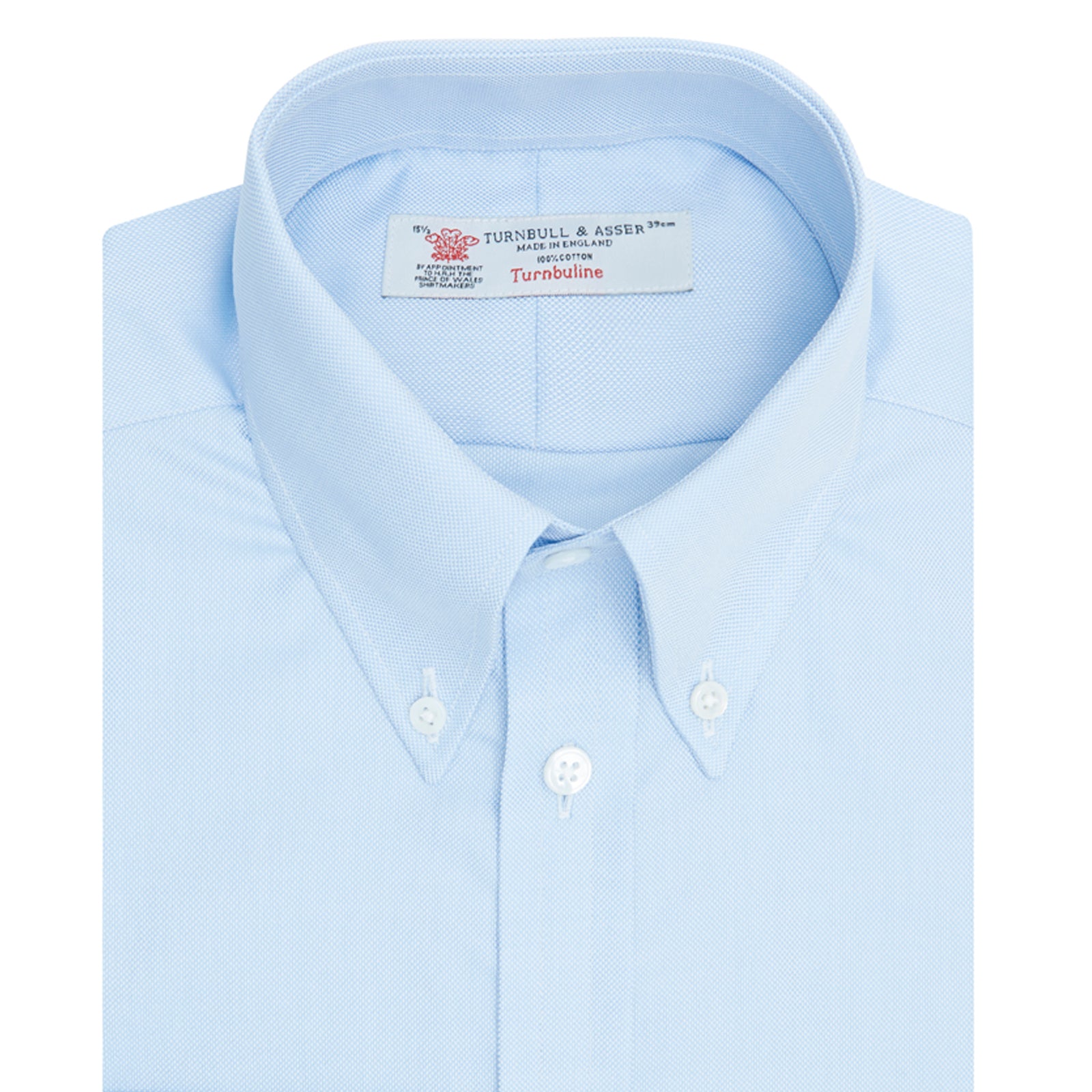 View 6 of product The Turnbull & Asser Light Blue Royal Oxford Cotton Shirt features a button-down collar, 3-button cuffs, and white buttons. Neatly folded with a visible inner label, it’s ideal to pair with a navy suit and displayed on a plain white background.