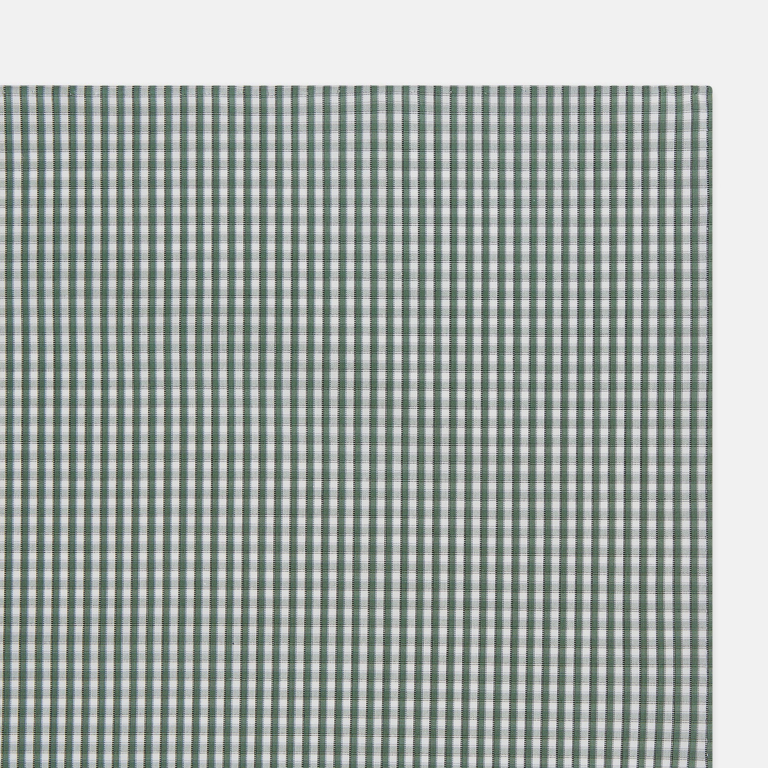 Image 2 of product The Turnbull & Asser Melon Green Micro Shadow Check Hand-Rolled Handkerchief is displayed flat against a white background, showcasing its green and white check pattern and expertly hand-rolled edges.
