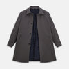 View 4 of product The Turnbull & Asser Charcoal Melange John Arthur Trench Coat, featuring a collar, single-breasted closure, and three zippered pockets—one chest and two at the hips—is shown against a plain white background.