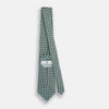 View 4 of product The Turnbull & Asser Light Blue and Chartreuse Lemon Weave Patterned Silk Tie, crafted from fine English silk, features a geometric design in blue and green tones, displayed on a plain white background.