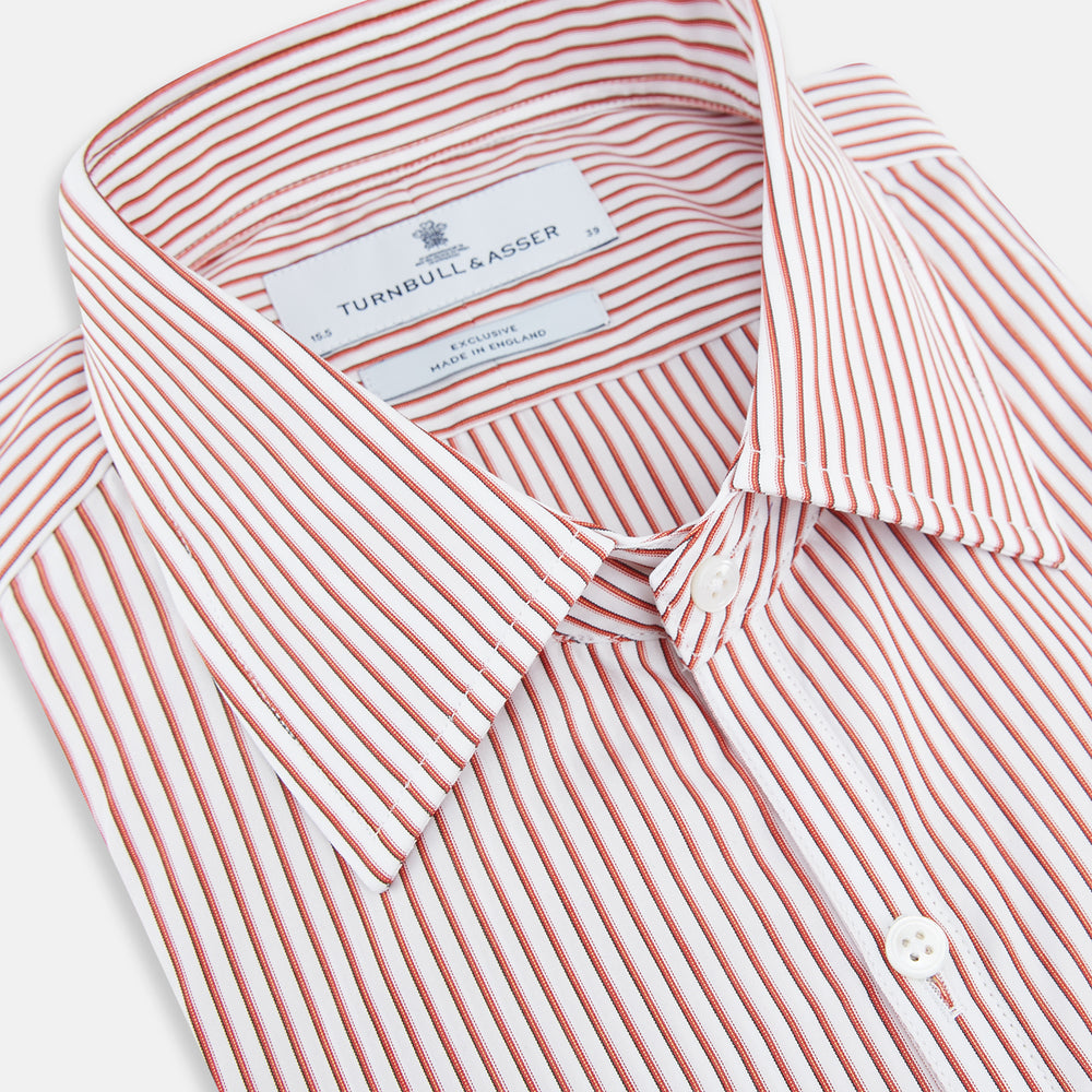 The Red Shadow Stripe Westminster Shirt by Turnbull & Asser features long sleeves, a Turnbull collar, thin red and white vertical stripes, white buttons, and showcases British craftsmanship against a plain white background.