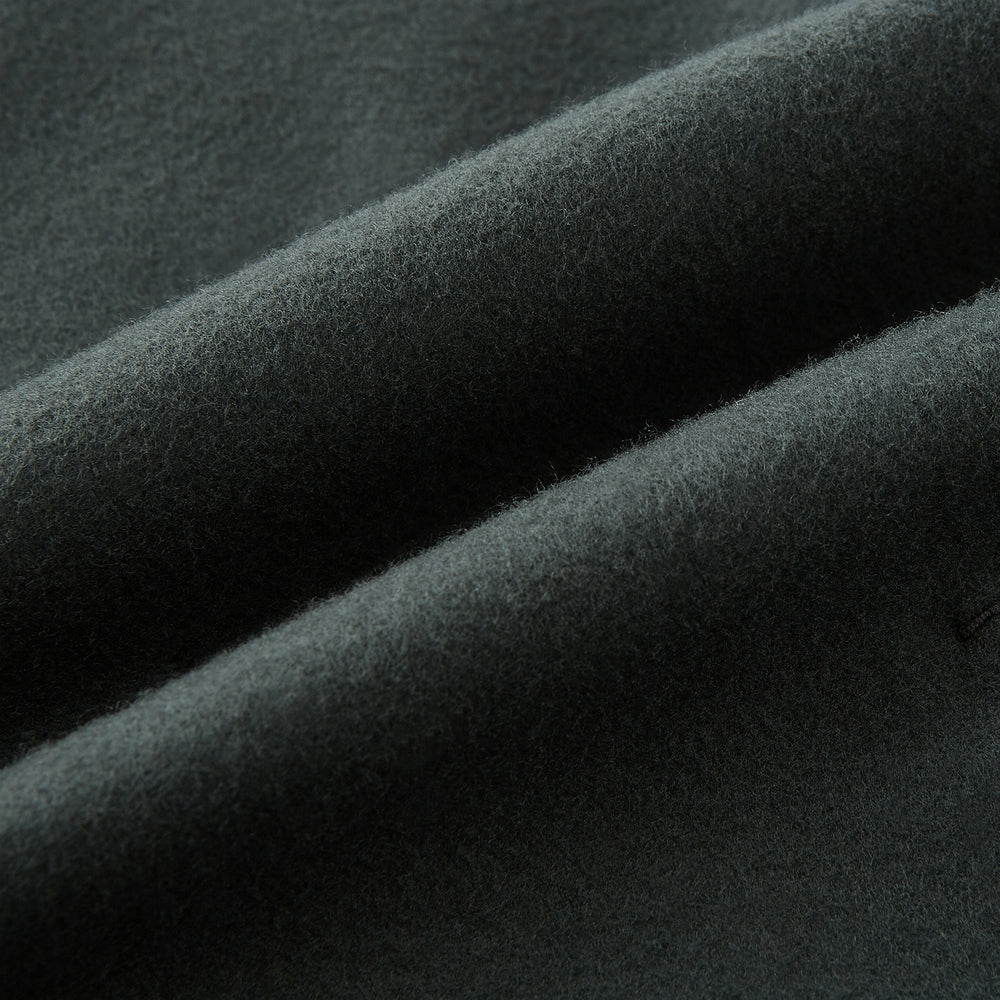 The Turnbull & Asser Moss Green Apsley Single-Breasted Caban Coat, featuring three buttons, a notched lapel, and three front pockets, is showcased on a plain white background.