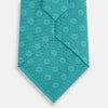 View 3 of product The Turquoise Medallion Silk Tie by Turnbull & Asser is crafted from fine English silk and features a repeating medallion pattern in lighter shades on turquoise.