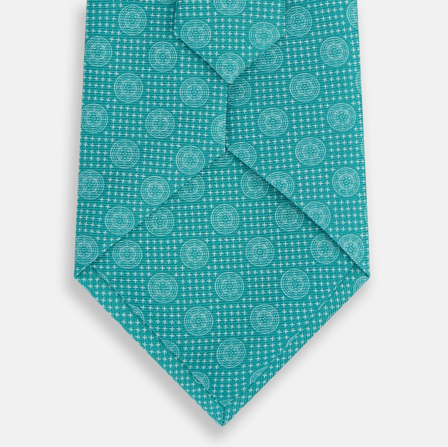 View 3 of product The Turquoise Medallion Silk Tie by Turnbull & Asser is crafted from fine English silk and features a repeating medallion pattern in lighter shades on turquoise.