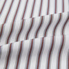View 5 of product The Burgundy Multi Stripe Winston Gown by Turnbull & Asser features long sleeves, a shawl collar, waist belt, three pockets, and red piping accents for a classic Churchill-inspired touch.