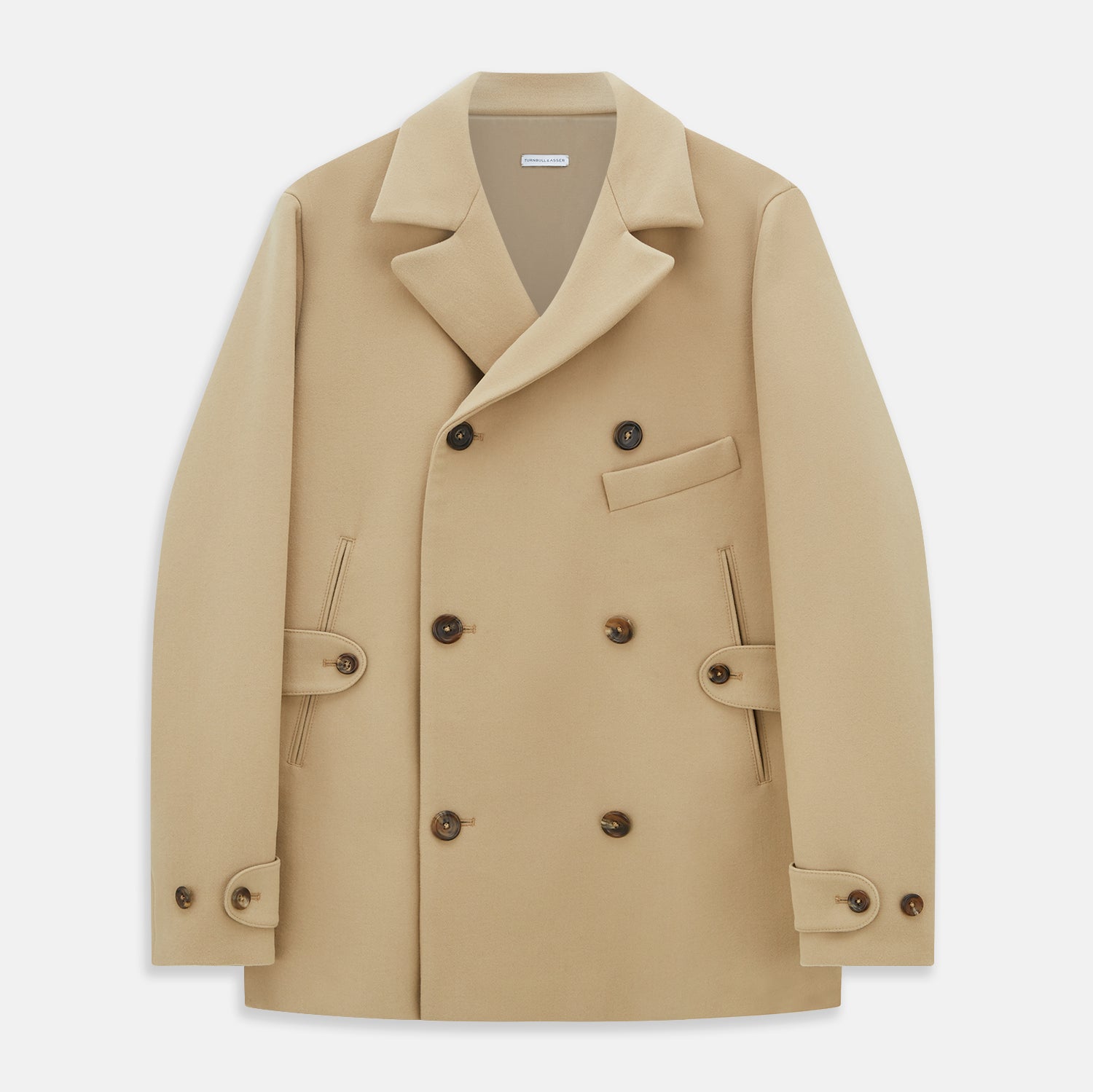 View 1 of product The Camel Wellington Double-Breasted Caban Coat by Turnbull & Asser features wide lapels, dark buttons, front flap and chest pockets, plus buttoned cuffs—perfect for elevating your formal wear collection.