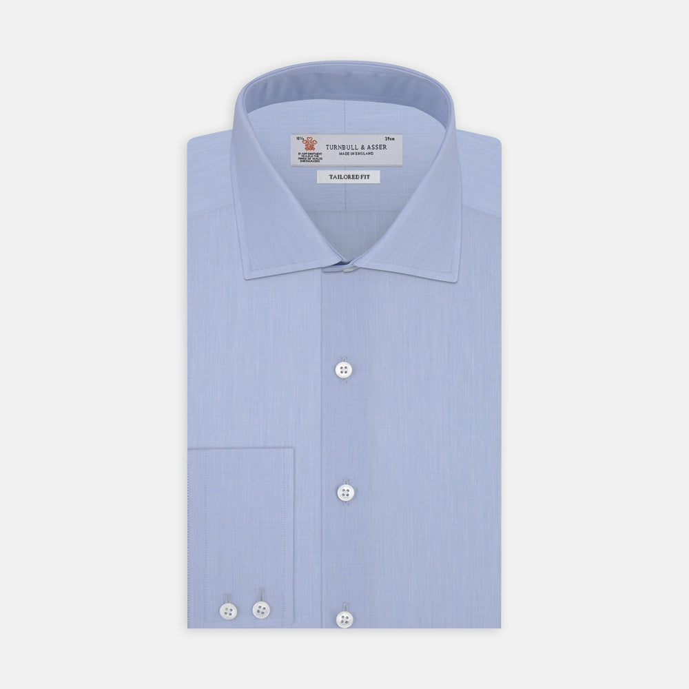 A Turnbull & Asser Tailored Fit Light Blue End-on-End Shirt with a Kent collar and 2-button cuffs is shown neatly folded on a plain white background. The shirt features classic styling and the Turnbull & Asser label.