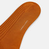 View 3 of product The Pumpkin Mid-Length Sock by Turnbull & Asser, a single orange knee-high ribbed design, is shown upright against a plain white background.