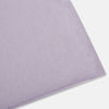 View 2 of product The Turnbull & Asser Plain Lilac Cashmere Knitted Scarf is shown neatly tied in a loose knot against a plain white background, highlighting its elegant and timeless design.