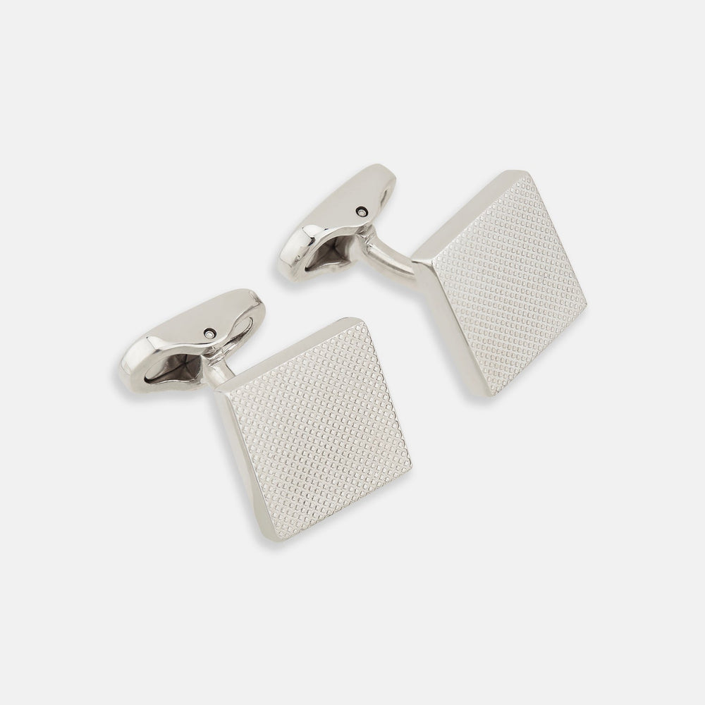 Turnbull & Asser's Silver Textured Square Cufflinks feature a dotted, polished finish and are showcased against a plain white background.