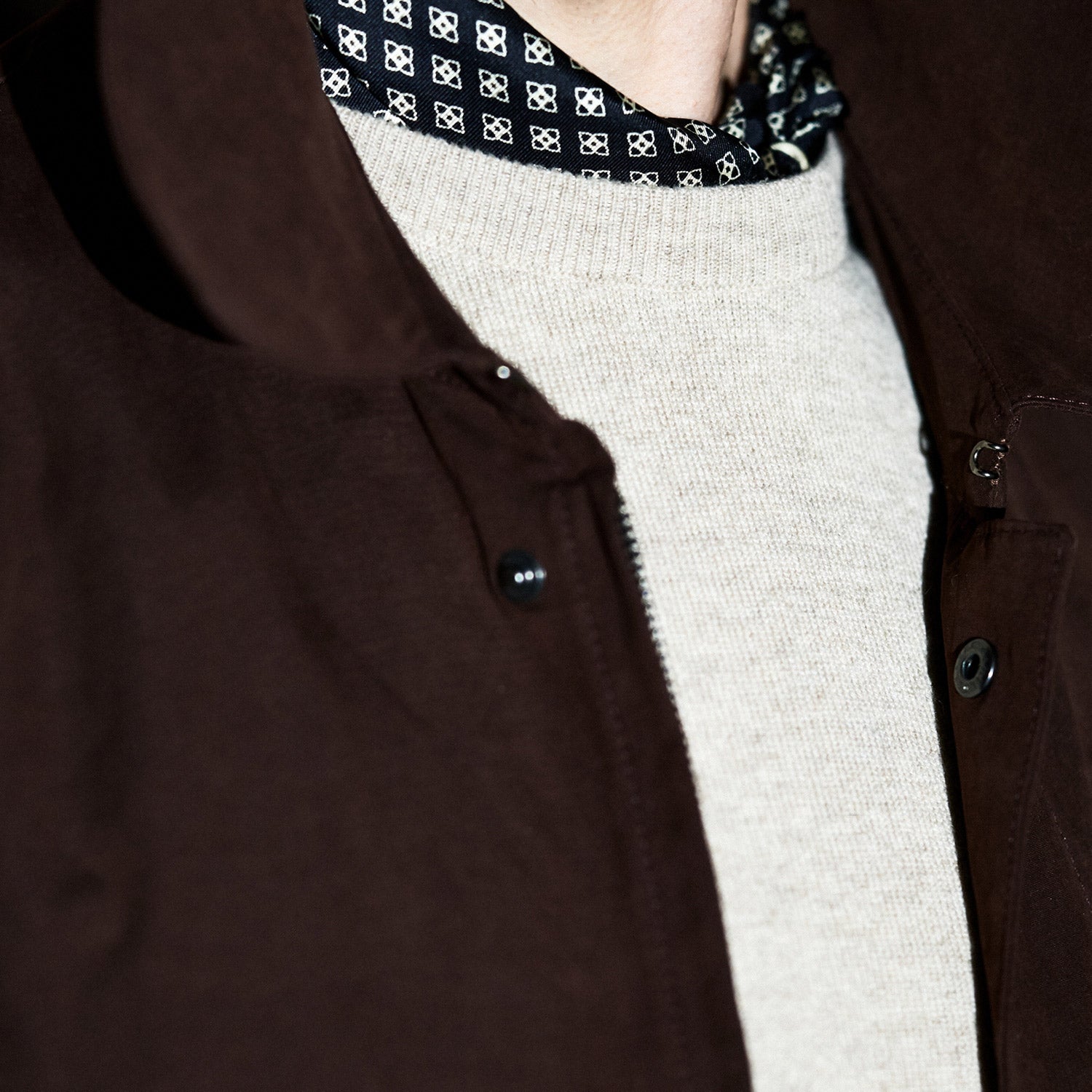 View 3 of product The Burgundy Grayson Car Coat by Turnbull & Asser, made from a rain-resistant cotton blend with a collar, hidden front buttons, and slanted pockets, is displayed flat on a white background in a minimalist style.