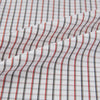 View 8 of product The Turnbull & Asser Red and Midnight Blue Tattersall Check Windsor Shirt features British craftsmanship, shown laid flat with sleeves extended and collar neatly folded.