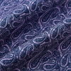 View 4 of product The Turnbull & Asser Lilac Paisley Silk Cravat showcases British elegance with its dark blue paisley pattern on a lilac background, beautifully displayed on a white surface.