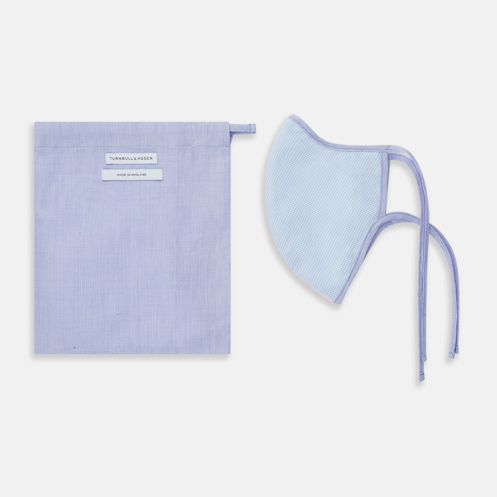 The Turnbull & Asser Pink & Blue Check Commuter Mask features lavender adjustable ear loops tied in bows and comes with 3 Viroformula™ filters. Shown on a plain white background.