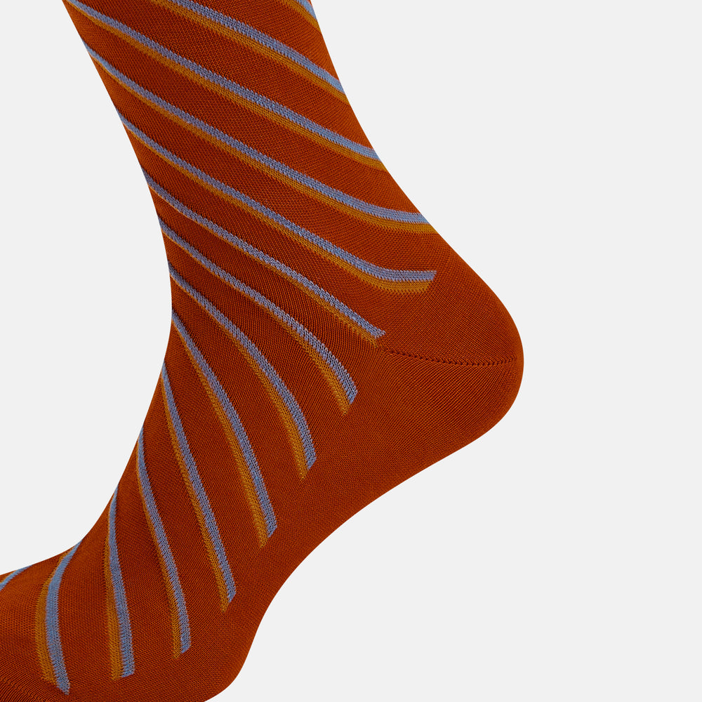 Turnbull & Asser Rust/orange/blue Diagonal Striped Long Sock shown knee-high and single on a white background.