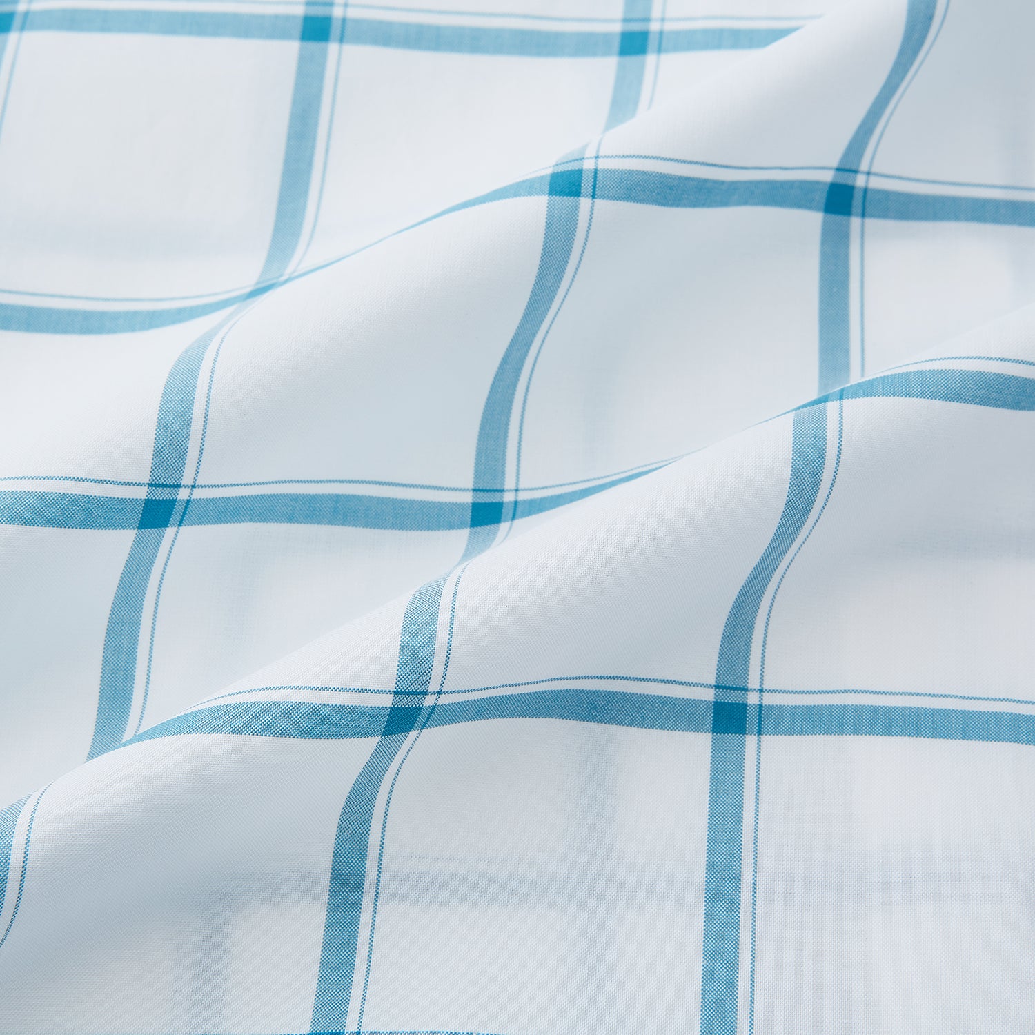 View 6 of product The Turnbull & Asser Turquoise Grid Check Mayfair Shirt is crafted from Italian cotton with a white base and turquoise grid pattern, featuring long sleeves, a pointed collar, and buttoned cuffs.