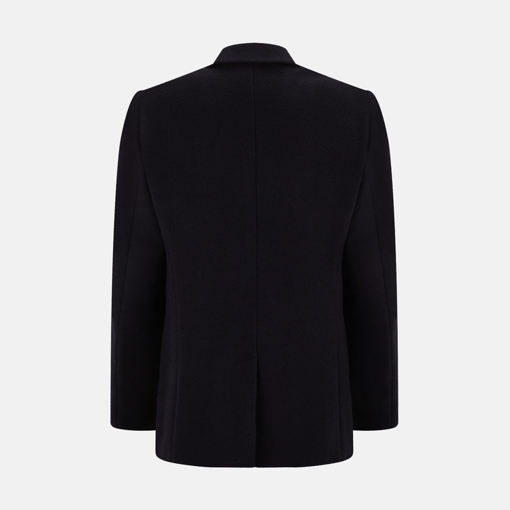 The Navy Apsley Single-Breasted Caban Coat by Turnbull & Asser features three buttons, notch lapels, a chest pocket, and two front flap pockets, shown against a plain light gray background.