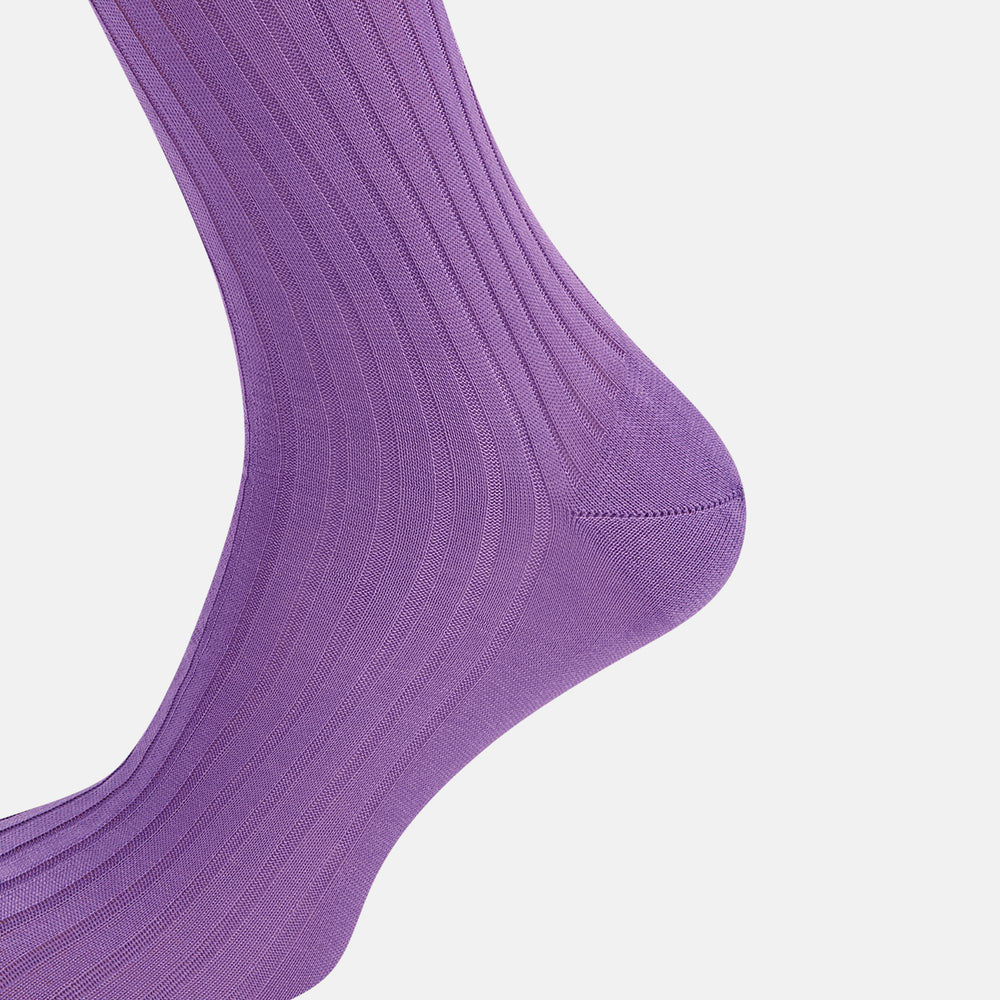 The Turnbull & Asser Violet Long Sock, crafted from mercerised Egyptian cotton, is shown in side profile against a white background, highlighting its knee-high length and ribbed texture.